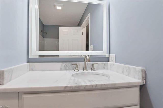 bathroom featuring vanity and walk in shower