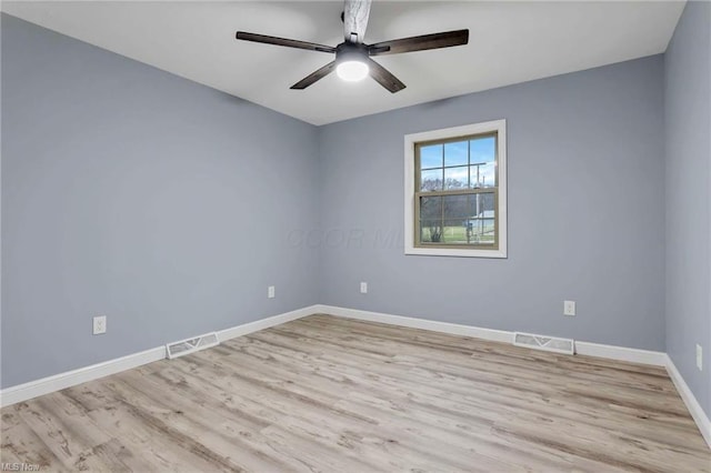 spare room with ceiling fan and light hardwood / wood-style flooring