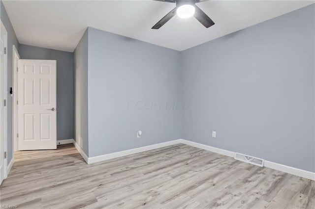 unfurnished room with ceiling fan and light wood-type flooring