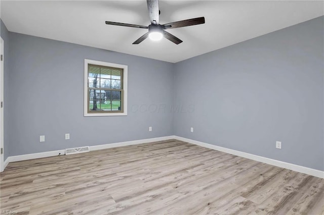 unfurnished room featuring light hardwood / wood-style flooring and ceiling fan