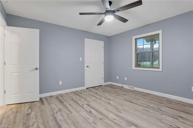 unfurnished bedroom featuring ceiling fan and light wood-type flooring