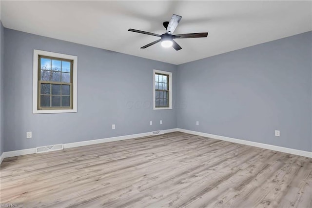 unfurnished room with ceiling fan and light hardwood / wood-style flooring