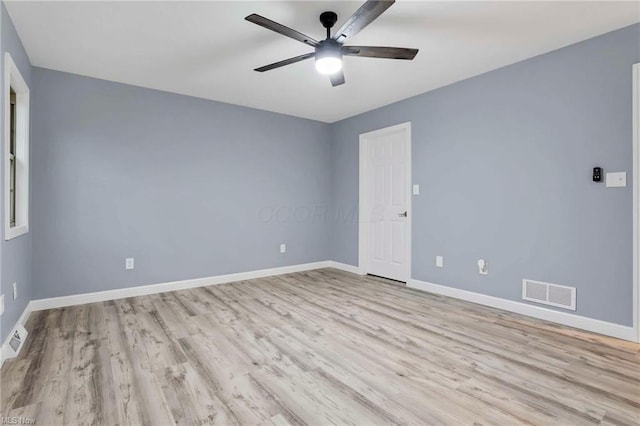 empty room with light hardwood / wood-style flooring and ceiling fan