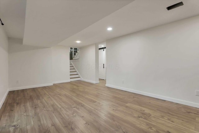 basement featuring light hardwood / wood-style floors