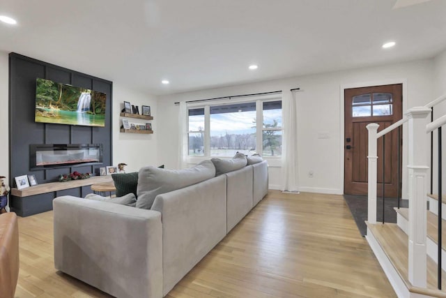 living room with light hardwood / wood-style floors