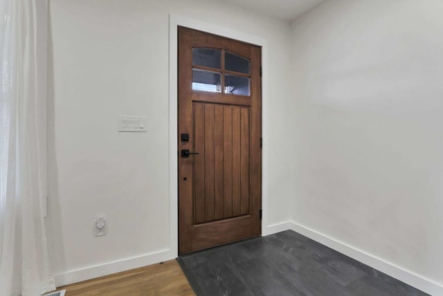 entrance foyer with dark hardwood / wood-style flooring