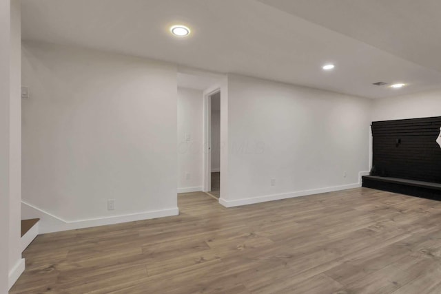 unfurnished living room with light wood-type flooring