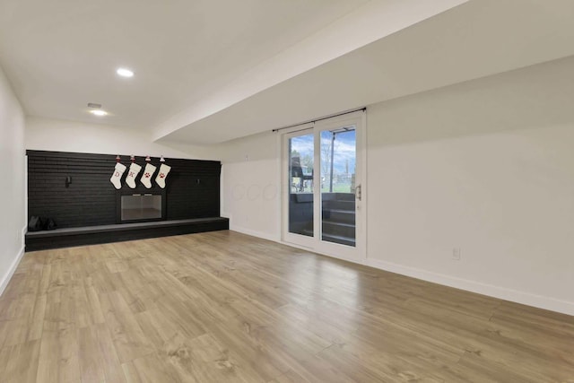 unfurnished room with light hardwood / wood-style floors