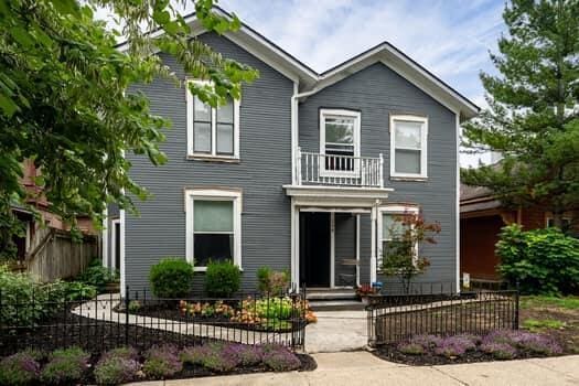 view of front of house featuring a balcony