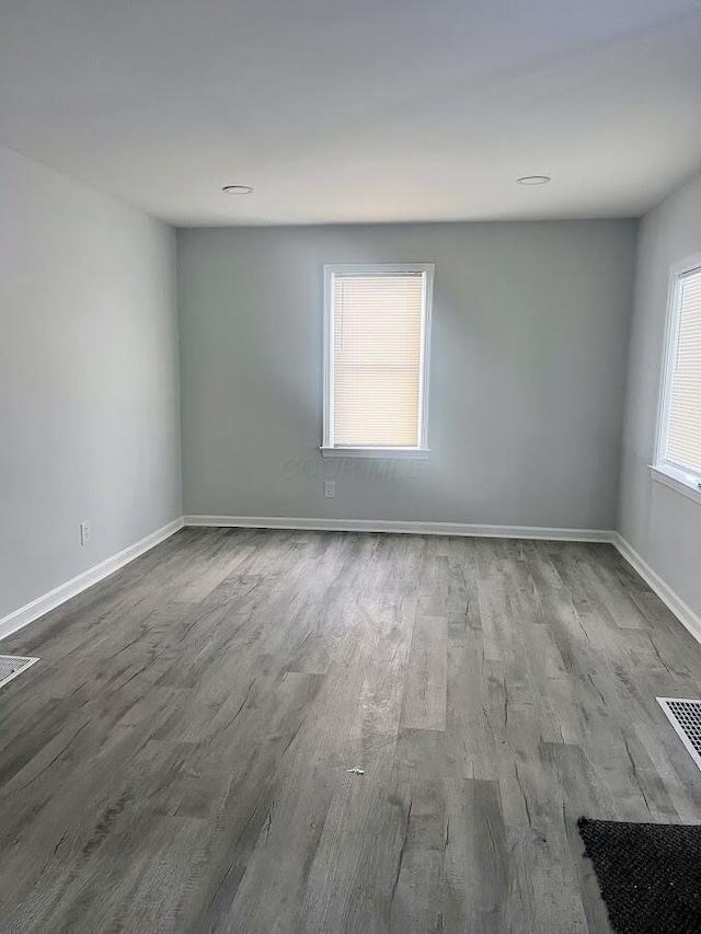 spare room with hardwood / wood-style flooring