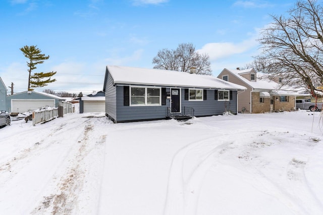 view of front of home with an outdoor structure and a garage