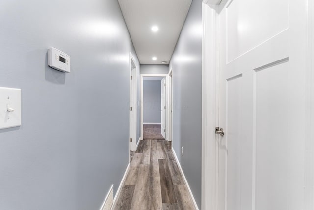 corridor featuring hardwood / wood-style flooring