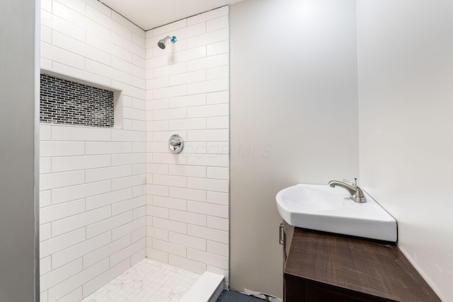 bathroom featuring sink and tiled shower