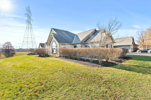 view of property exterior with a yard