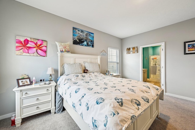 bedroom with carpet flooring and connected bathroom