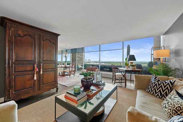 living room with an inviting chandelier and expansive windows