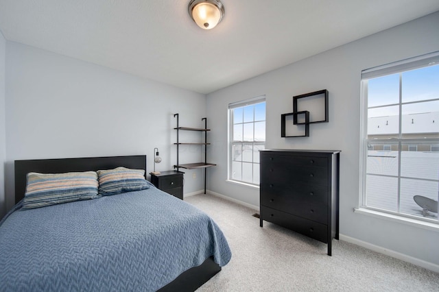 bedroom with light carpet