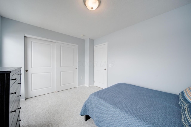 carpeted bedroom with a closet