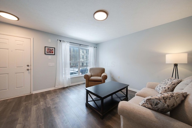 living room with dark hardwood / wood-style flooring