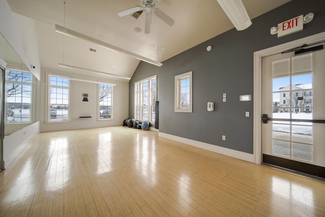 interior space with vaulted ceiling, light hardwood / wood-style flooring, and ceiling fan