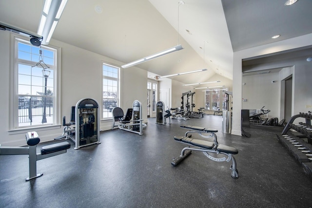 exercise room with vaulted ceiling