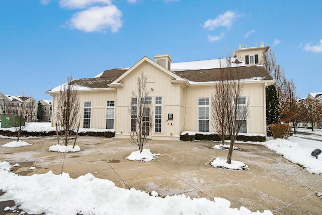 view of snow covered house