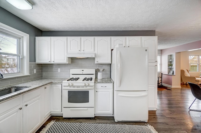 kitchen featuring white cabinetry, white appliances, and dark hardwood / wood-style flooring