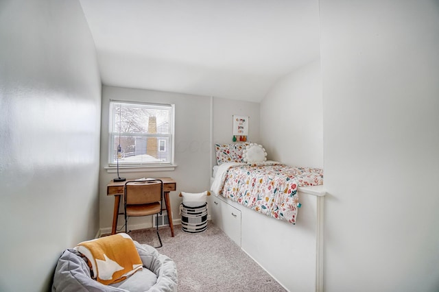 bedroom featuring carpet floors and vaulted ceiling