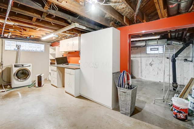 basement with washer / dryer and a wealth of natural light