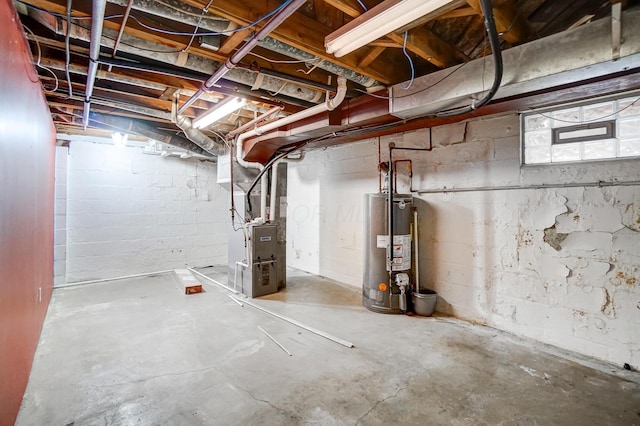 basement featuring heating unit and gas water heater