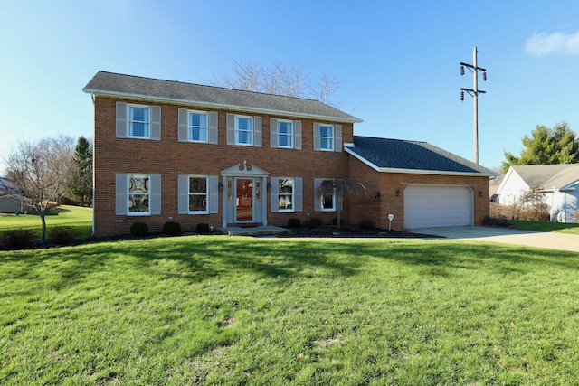 colonial-style house with a garage and a front lawn