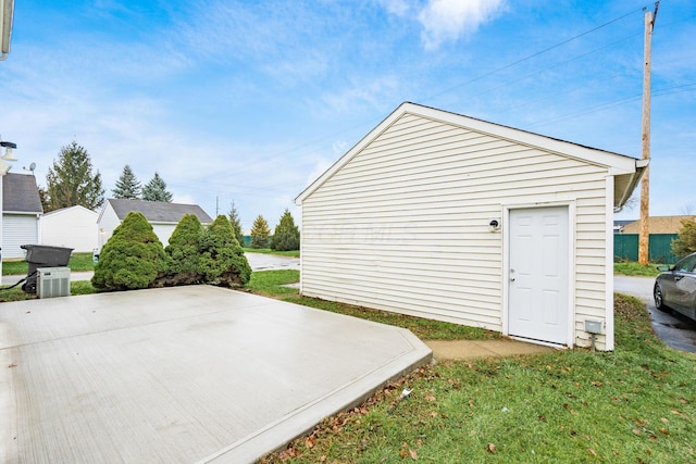 view of outdoor structure featuring a lawn