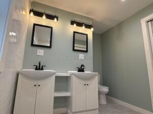 bathroom with vanity and toilet