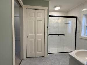 bathroom with an enclosed shower