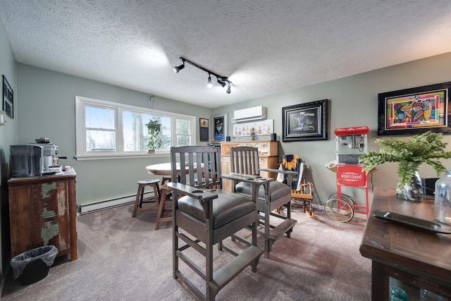 carpeted living room featuring a baseboard heating unit, an AC wall unit, track lighting, and a textured ceiling