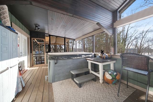 wooden terrace featuring a hot tub