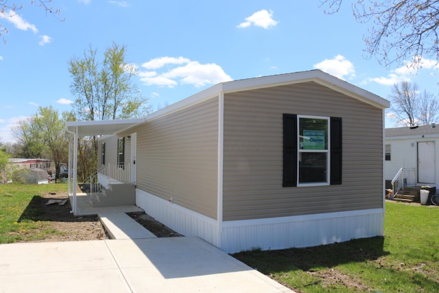 view of home's exterior with a yard