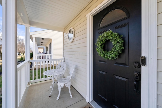 property entrance featuring covered porch