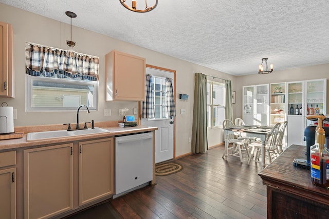 kitchen featuring dishwasher, pendant lighting, a textured ceiling, and sink