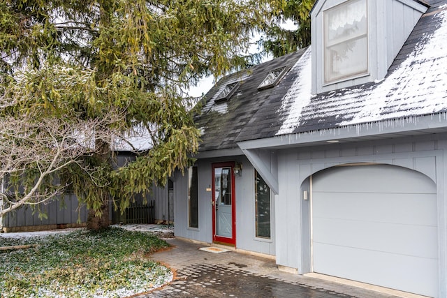 view of exterior entry featuring a garage