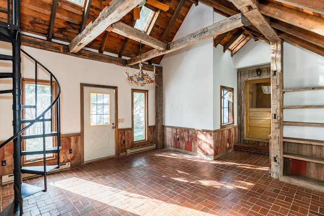 entrance foyer with wooden ceiling, a baseboard heating unit, wooden walls, and vaulted ceiling with beams