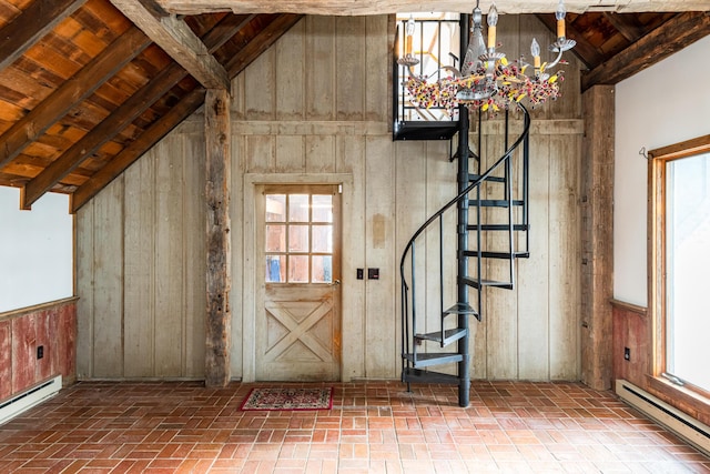 foyer featuring wood ceiling, beam ceiling, and a baseboard heating unit