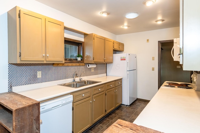 kitchen with sink, white appliances, and decorative backsplash