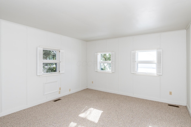 unfurnished room featuring carpet floors