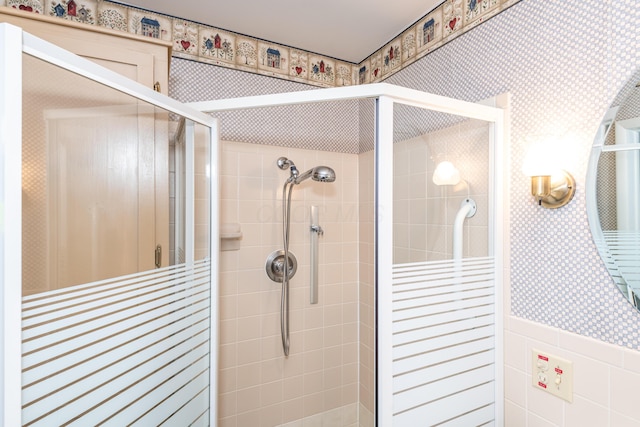 bathroom featuring a shower with door