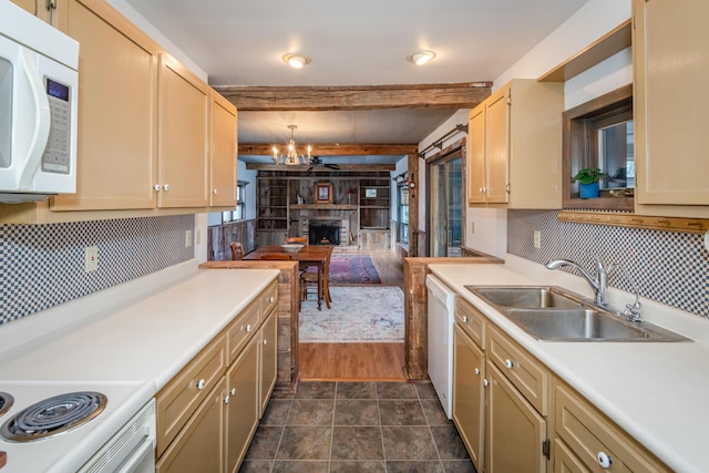 kitchen featuring sink, an inviting chandelier, hanging light fixtures, beamed ceiling, and white appliances