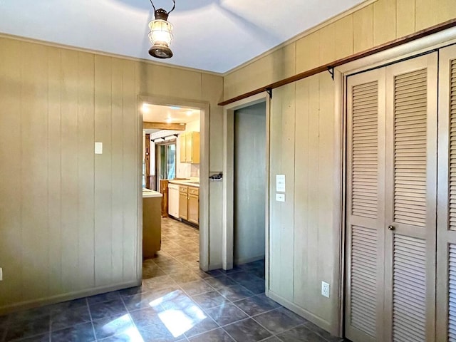 hallway with wood walls