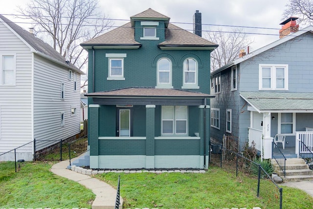 view of front of property featuring a porch and a front yard