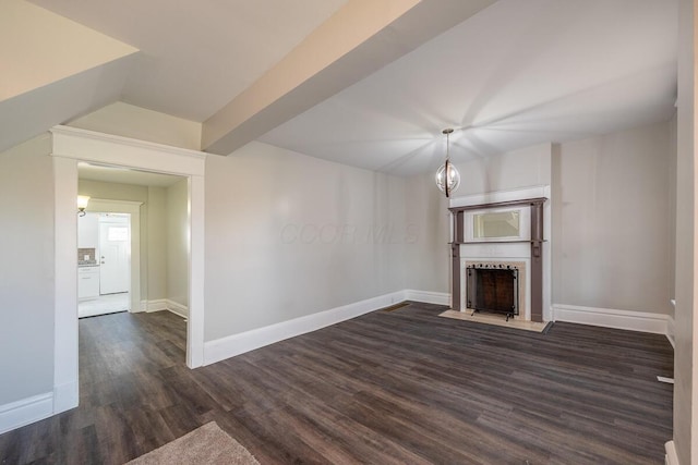 unfurnished living room with dark wood-type flooring