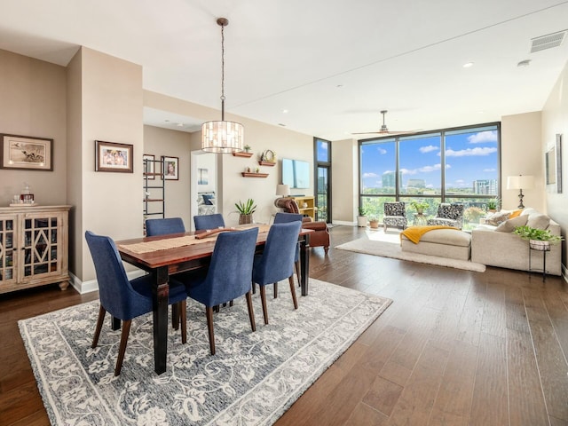 dining area with ceiling fan, dark hardwood / wood-style flooring, and floor to ceiling windows